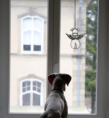 ZUAJITER hand-cut glass dog keepsake glows in sunlight, bringing a gentle tribute to cherished pets