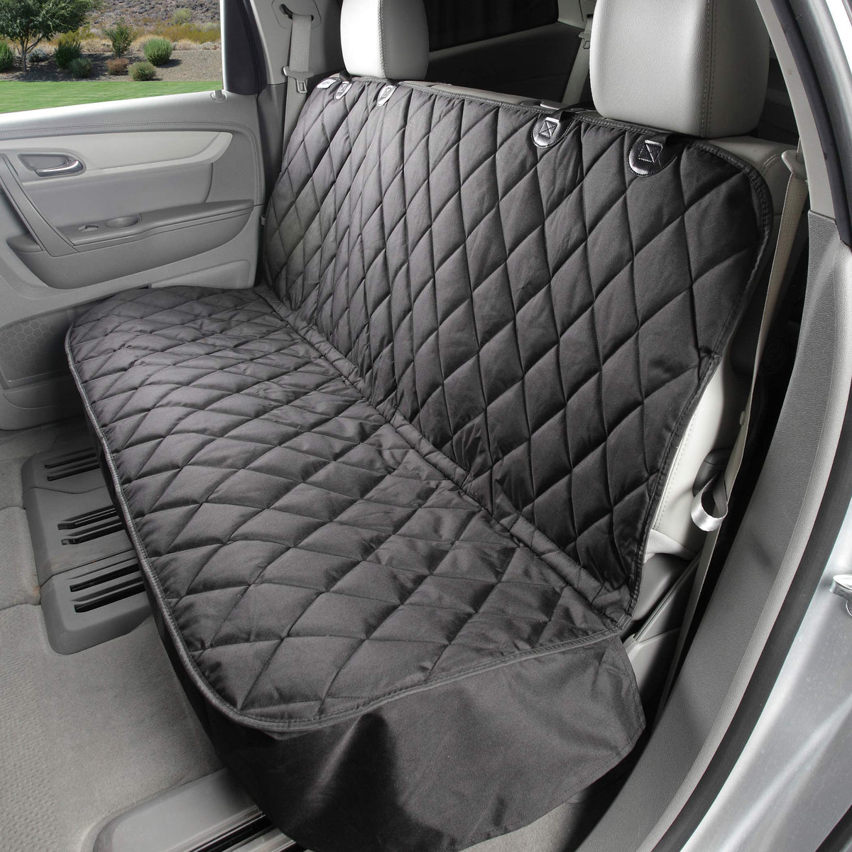 4Knines back-seat cover installed protects car upholstery during pet rides.