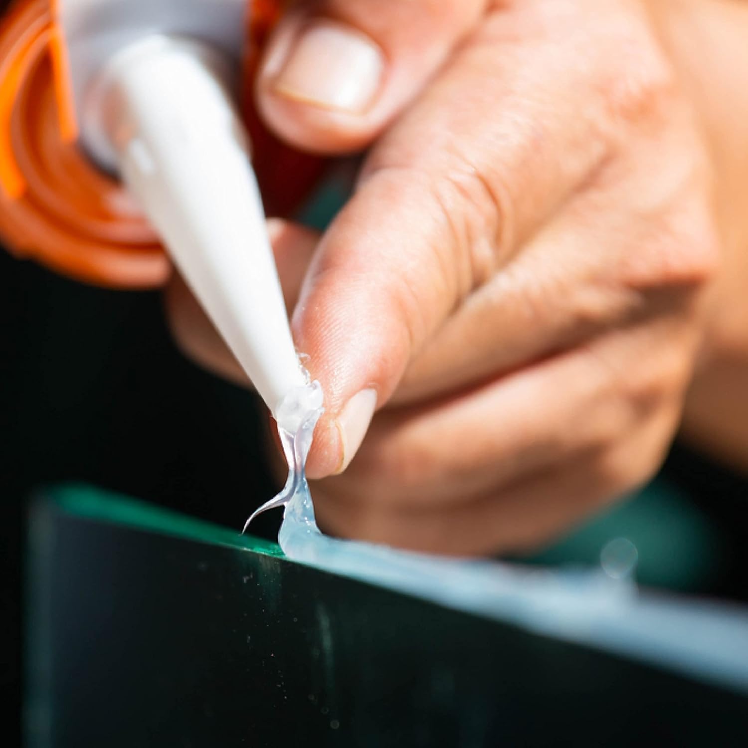 AG Adhesive Guru aquarium sealant decor-attachment illustrates securing ornaments to glass safely.