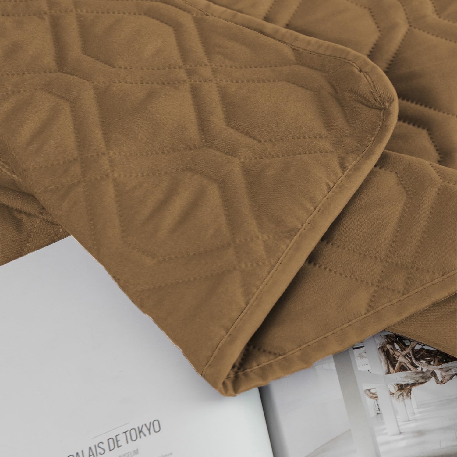 Ameritex dog-friendly furniture cover on bed guards against pet messes and stains.