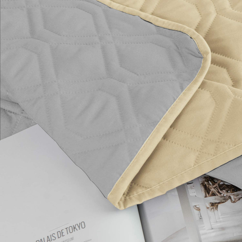 Ameritex soft luxury pet blanket drapes over a couch after playtime.