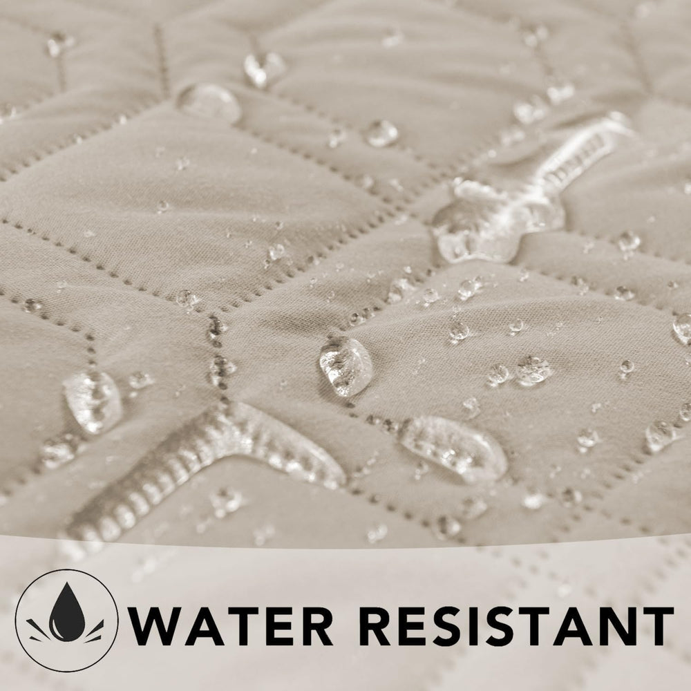 Ameritex waterproof dog bed cover on couch demonstrates easy care.