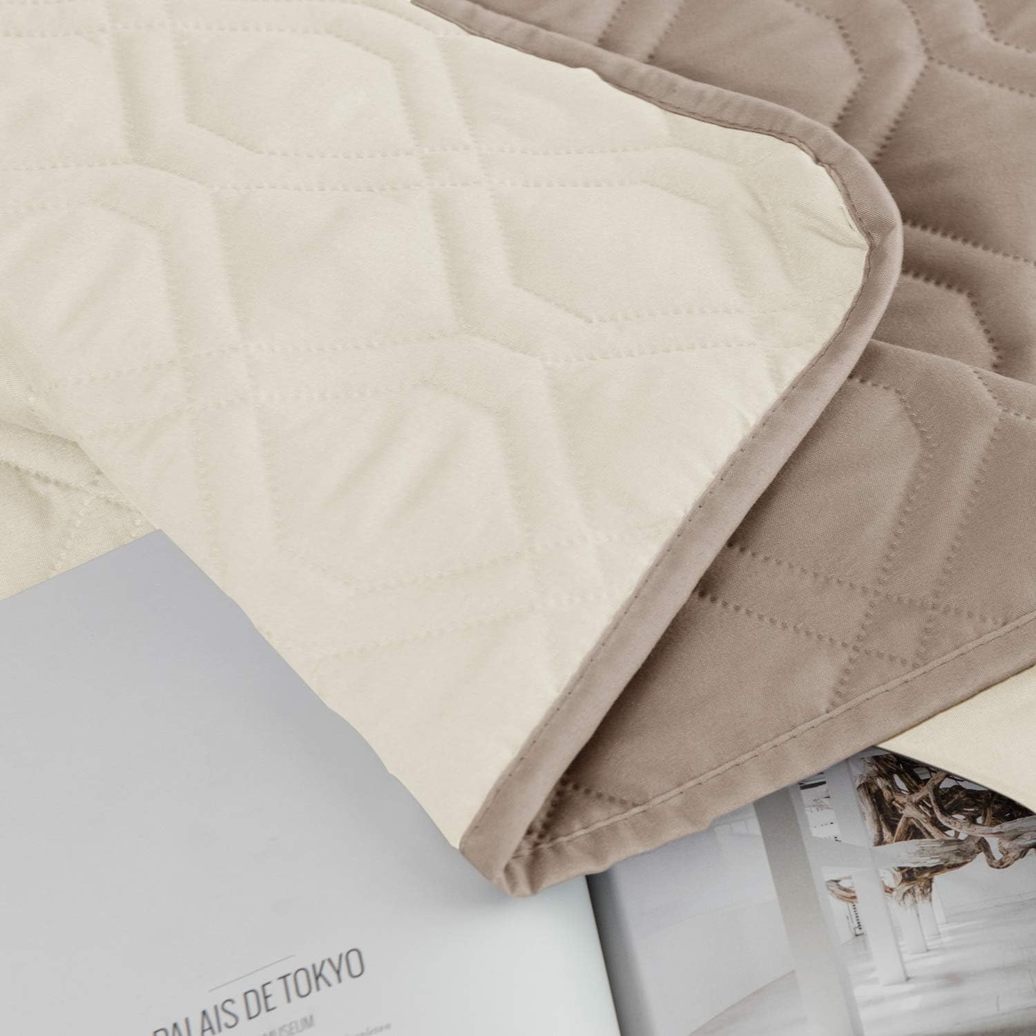 Ameritex waterproof protector on a bed demonstrates spill resistance for active households.