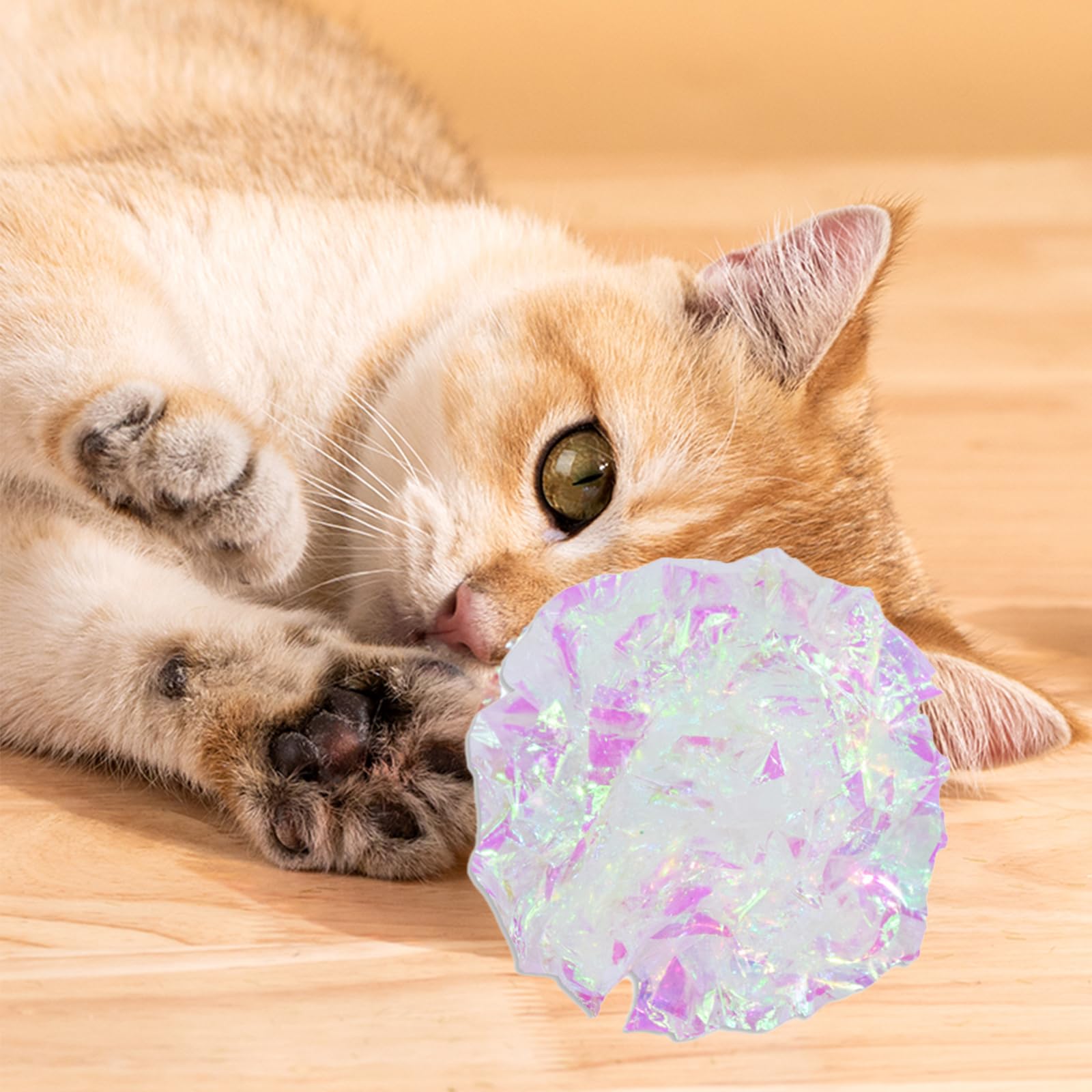Andiker cat crinkle ball white silver play scene shows indoor entertainment possibilities.