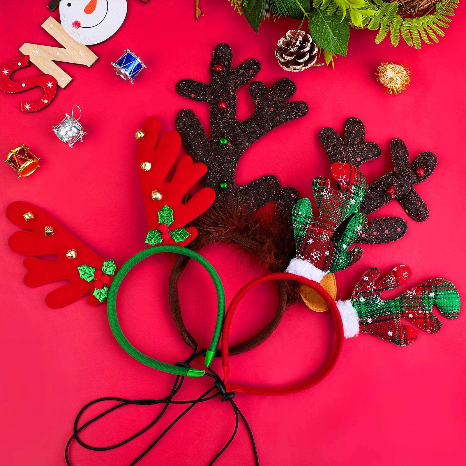 Three-pack Aneco reindeer headbands ready for quick style changes at a holiday setup.