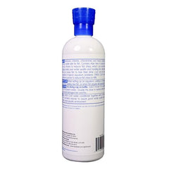 API Stress Coat bottle pour demonstrates dosing to protect fish during water changes
