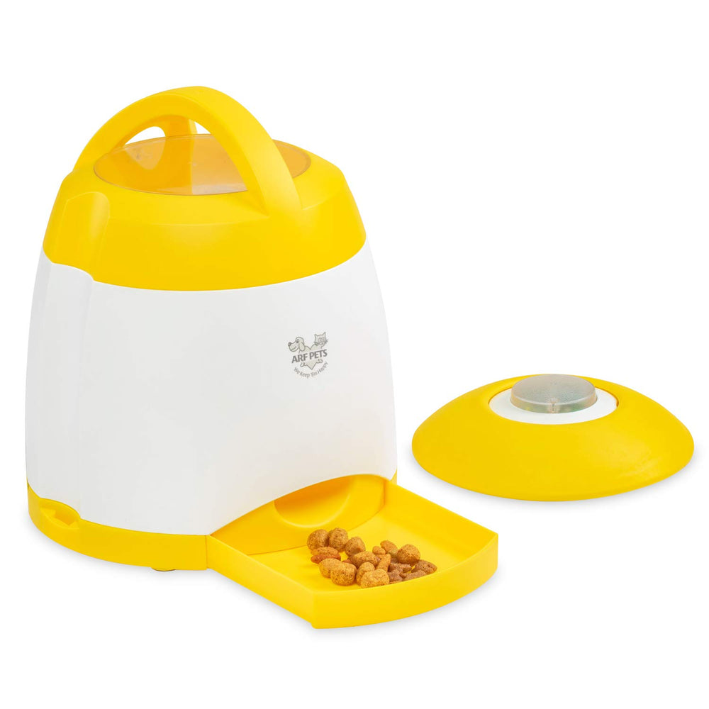 Arf Pets treat dispenser releasing a jackpot of rewards.