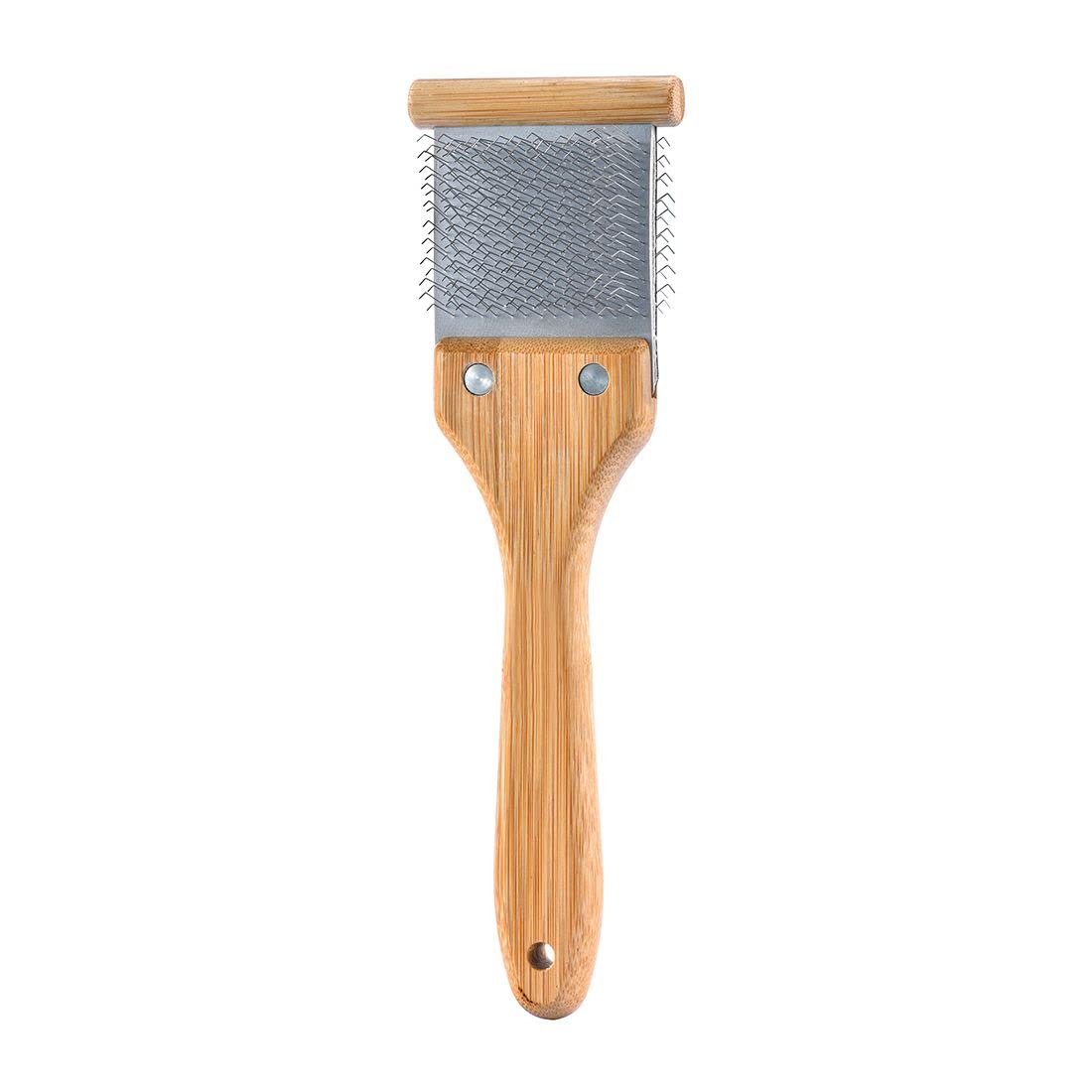 Artero Double Flexible Brush black-side pins untangle and lift underfur for easier brushing.