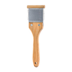 Artero Double Flexible Brush black-side pins untangle and lift underfur for easier brushing.