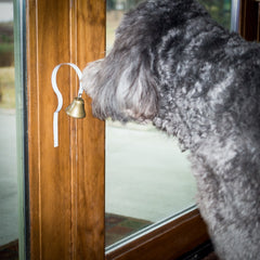 GoGo Bell metal construction emphasizes safety by avoiding slots that snag paws.