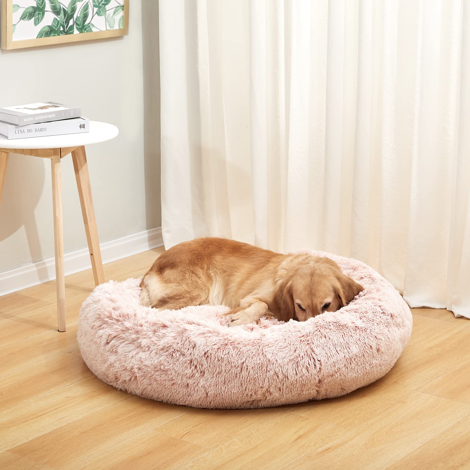 Bedfolks Calming Donut Dog Bed pink donut shape side view supports curling comfort