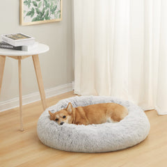 Bedfolks Calming Donut Dog Bed close-up shows soft faux fur for cozy lounging.