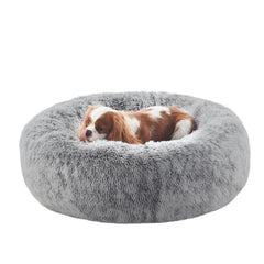 BedStill donut dog bed outer view shows plush comfort for calming naps.
