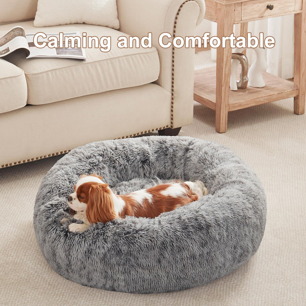 BedStill donut dog bed side view highlights raised edge for secure rest.