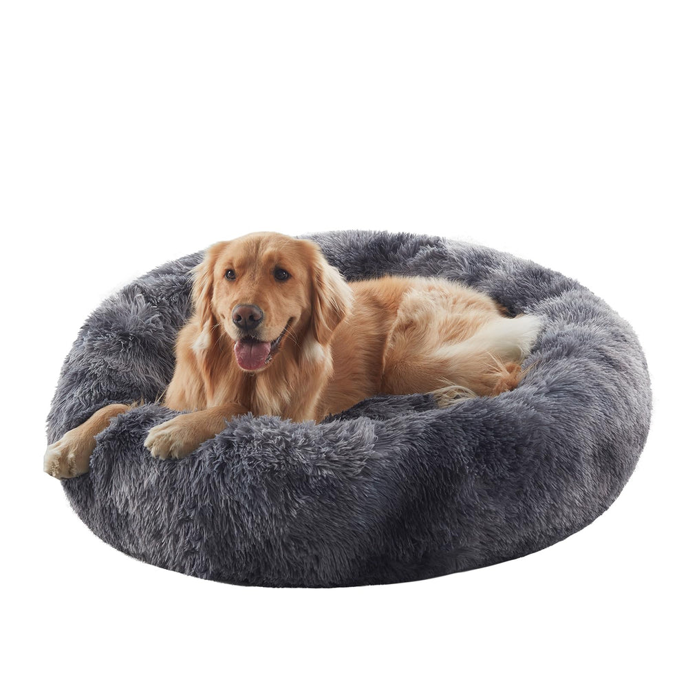 BedStill donut dog bed tie-dye grey side view showing cozy, secure design ideal for anxious dogs.