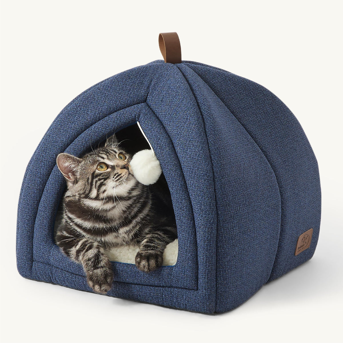 Bedsure cat bed navy exterior shows soft faux-linen texture for a cozy indoor retreat.