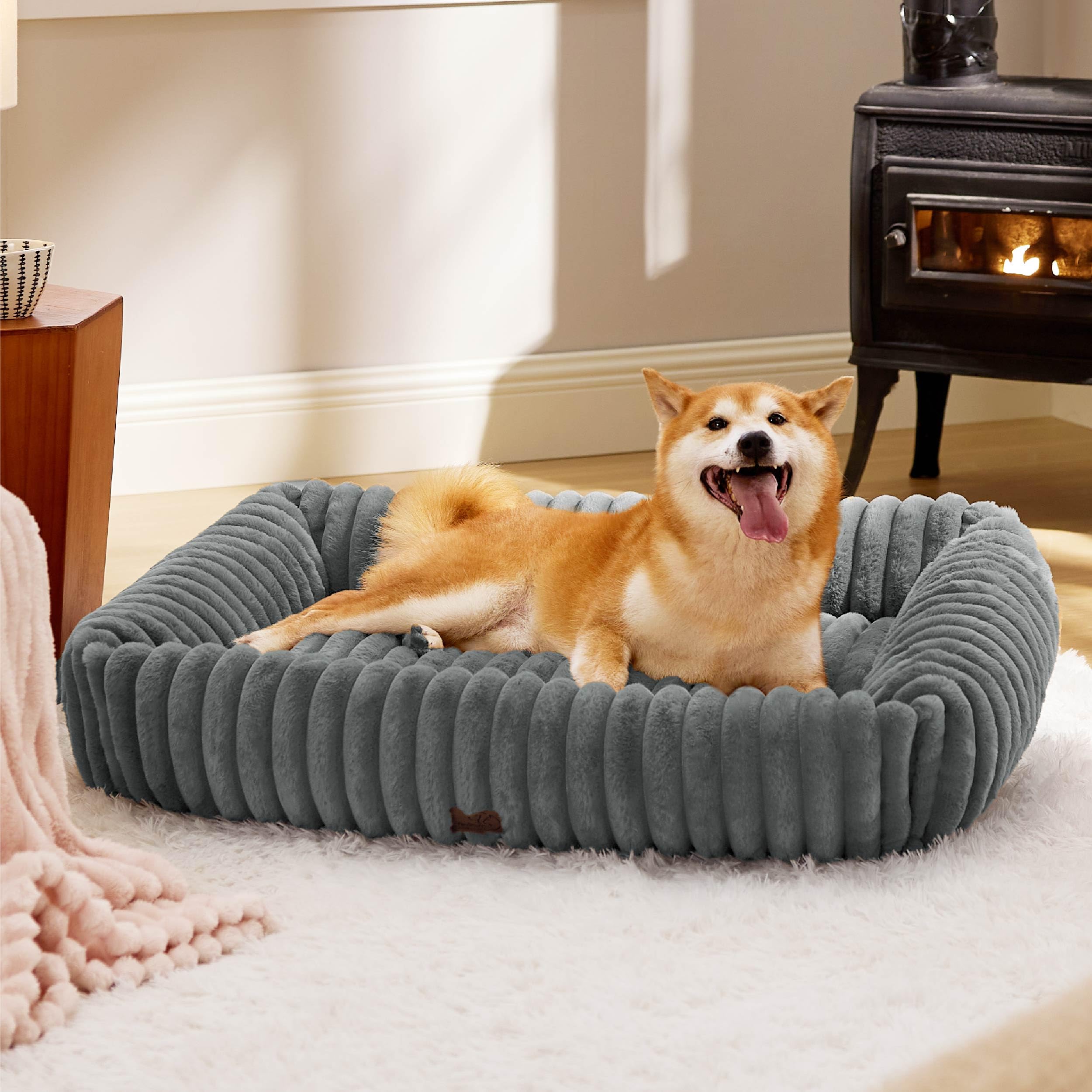 Bedsure dog bed large raised sides offers a cozy headrest for restful sleep.
