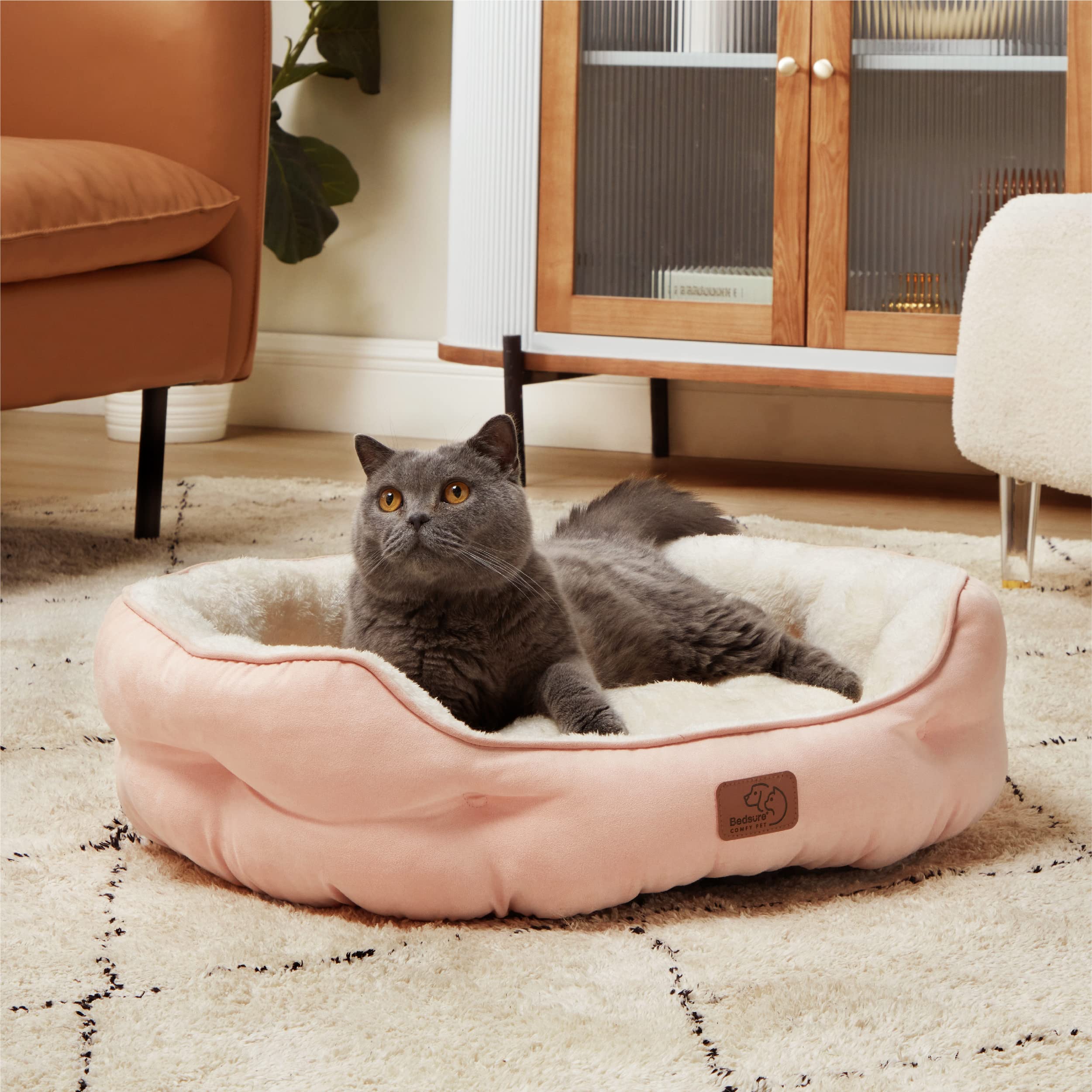 Bedsure peach pink round bed in a cozy home setting