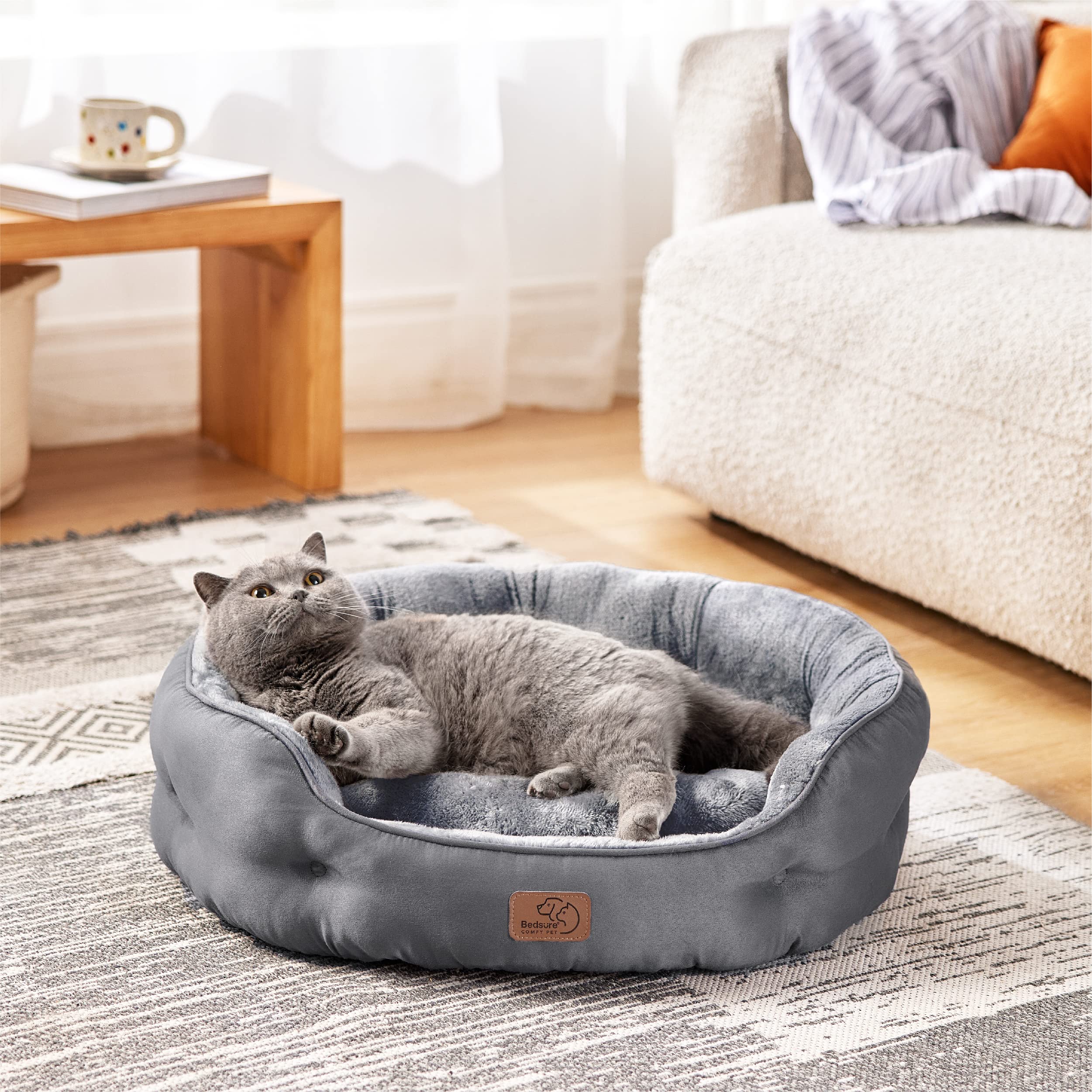 Bedsure round dog bed bolster-comfort with raised edge supports head and neck.