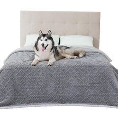 Bedsure waterproof dog blanket on bed protects furniture from spills and pet hair.