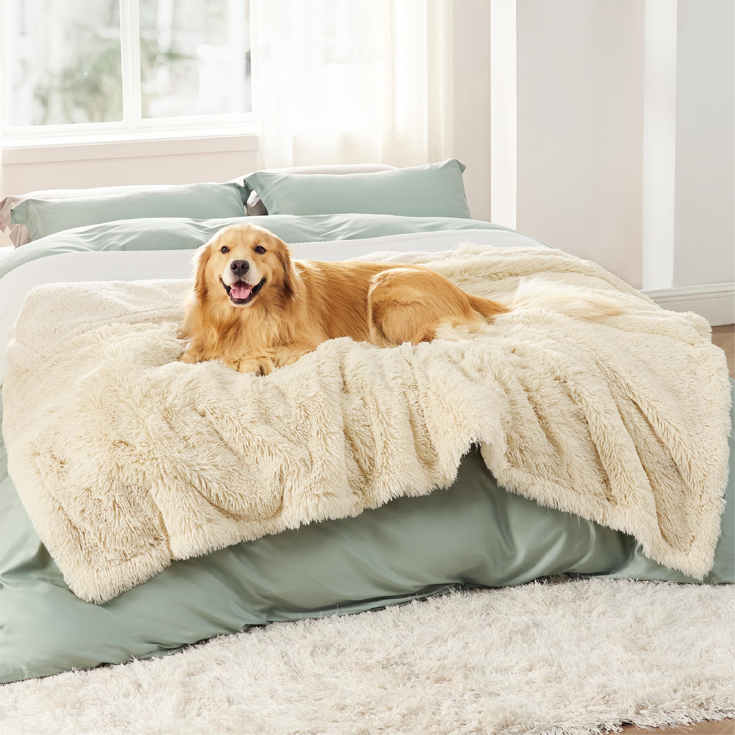 Bedsure waterproof dog blanket cream protecting a sofa from pet messes
