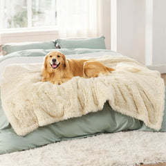 Bedsure waterproof dog blanket cream protecting a sofa from pet messes