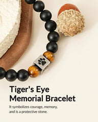 Belloxis engraved paw print charm close-up as a personal keepsake after loss