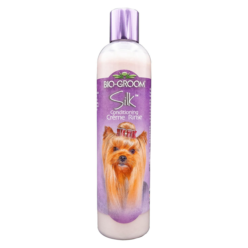 Bio-Groom Silk Creme Rinse bottle pour shows easy conditioning for a softer coat.