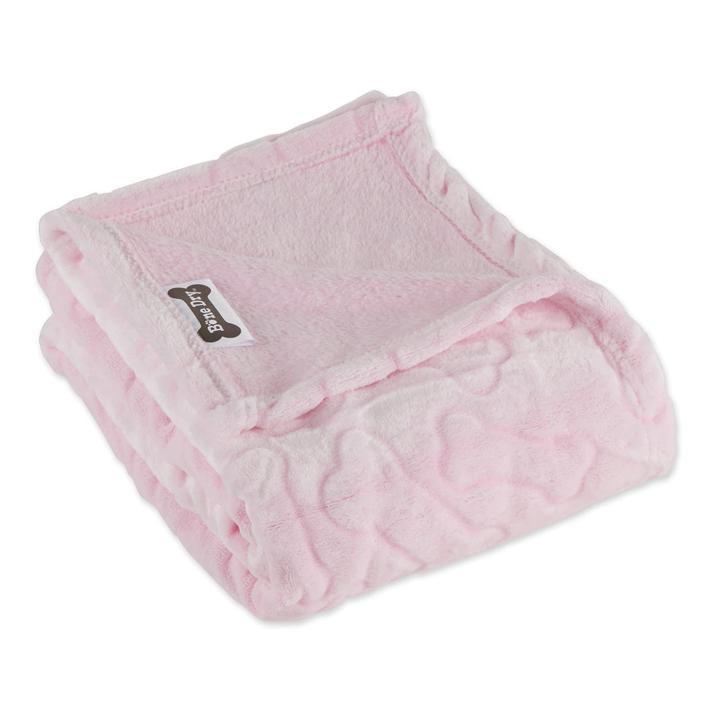 Dog relaxing on Bone Dry blanket emphasizes comfort and furniture protection.