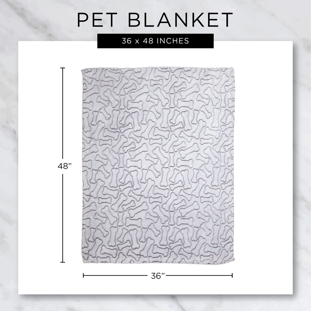Bone Dry folded blanket shows storage-friendly size and lightweight feel.