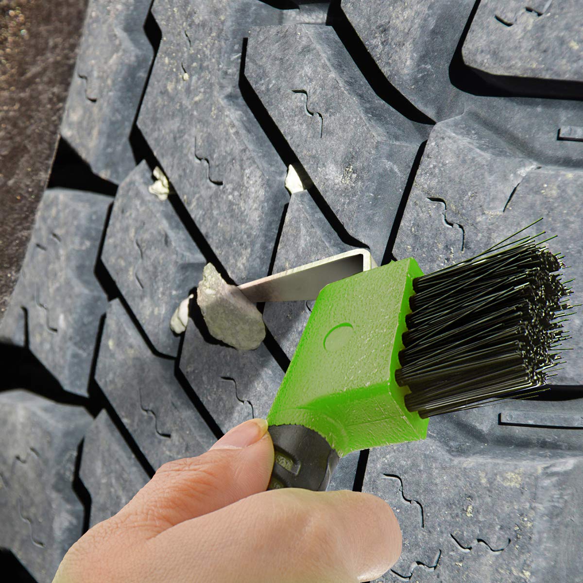 BOTH WINNERS multi-use hoof pick in a stable cleaning scenario for boots and hooves
