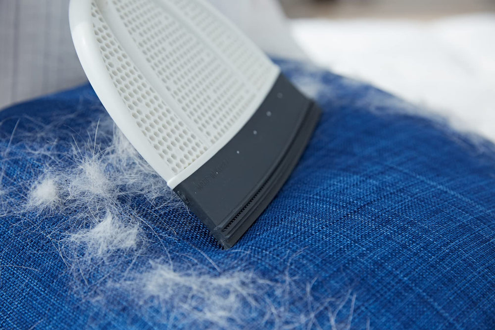 Broombi Pet Hair Remover cleans car seats for travel-ready interiors.