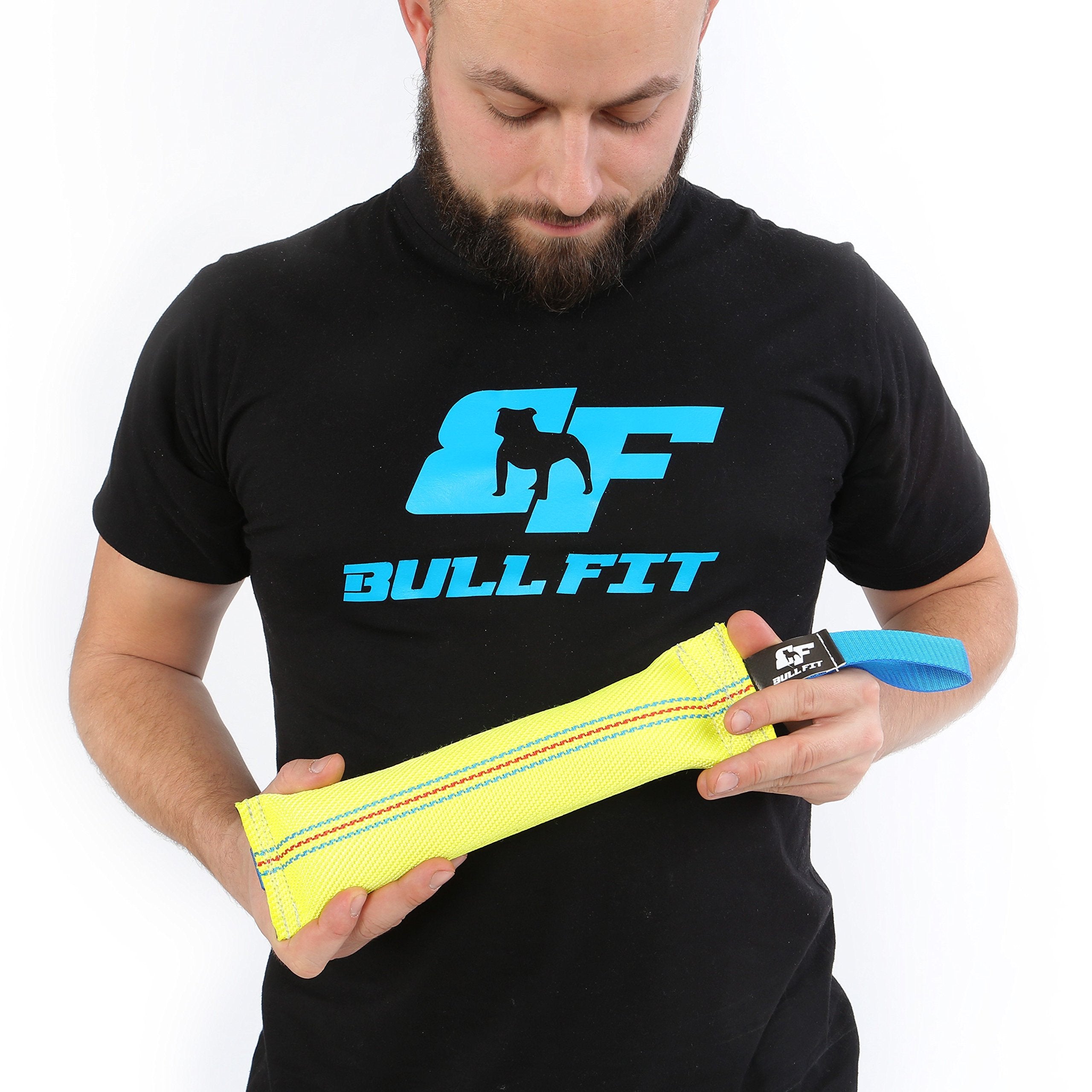 Bull Fit fetch-ready tug toy in yard setting.