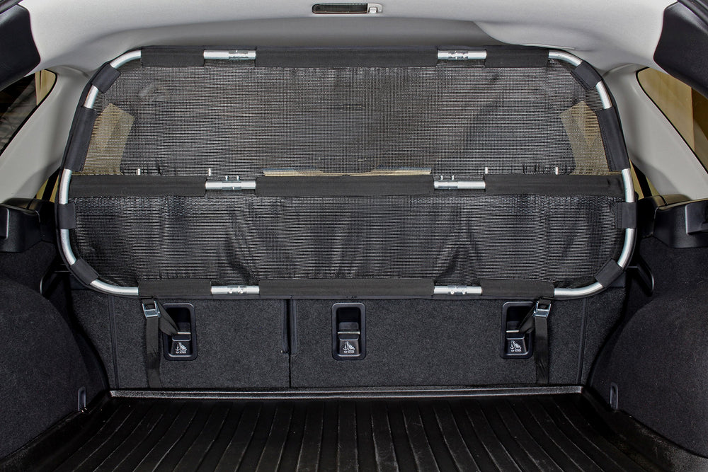 Bushwhacker cargo barrier assembly view demonstrates quick, tool-free installation for safer trips.