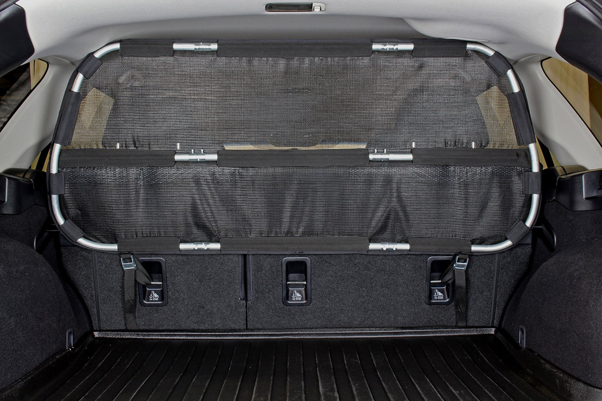 Bushwhacker cargo barrier assembly view demonstrates quick, tool-free installation for safer trips.