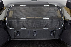 Bushwhacker cargo barrier assembly view demonstrates quick, tool-free installation for safer trips.