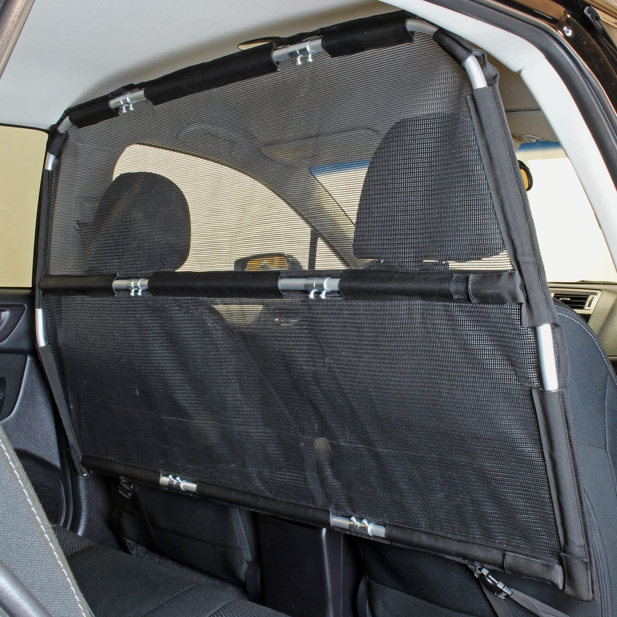 Bushwhacker Deluxe Dog Barrier front-seat attachment demonstrates easy installation