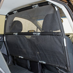 Bushwhacker Deluxe Dog Barrier front-seat attachment demonstrates easy installation