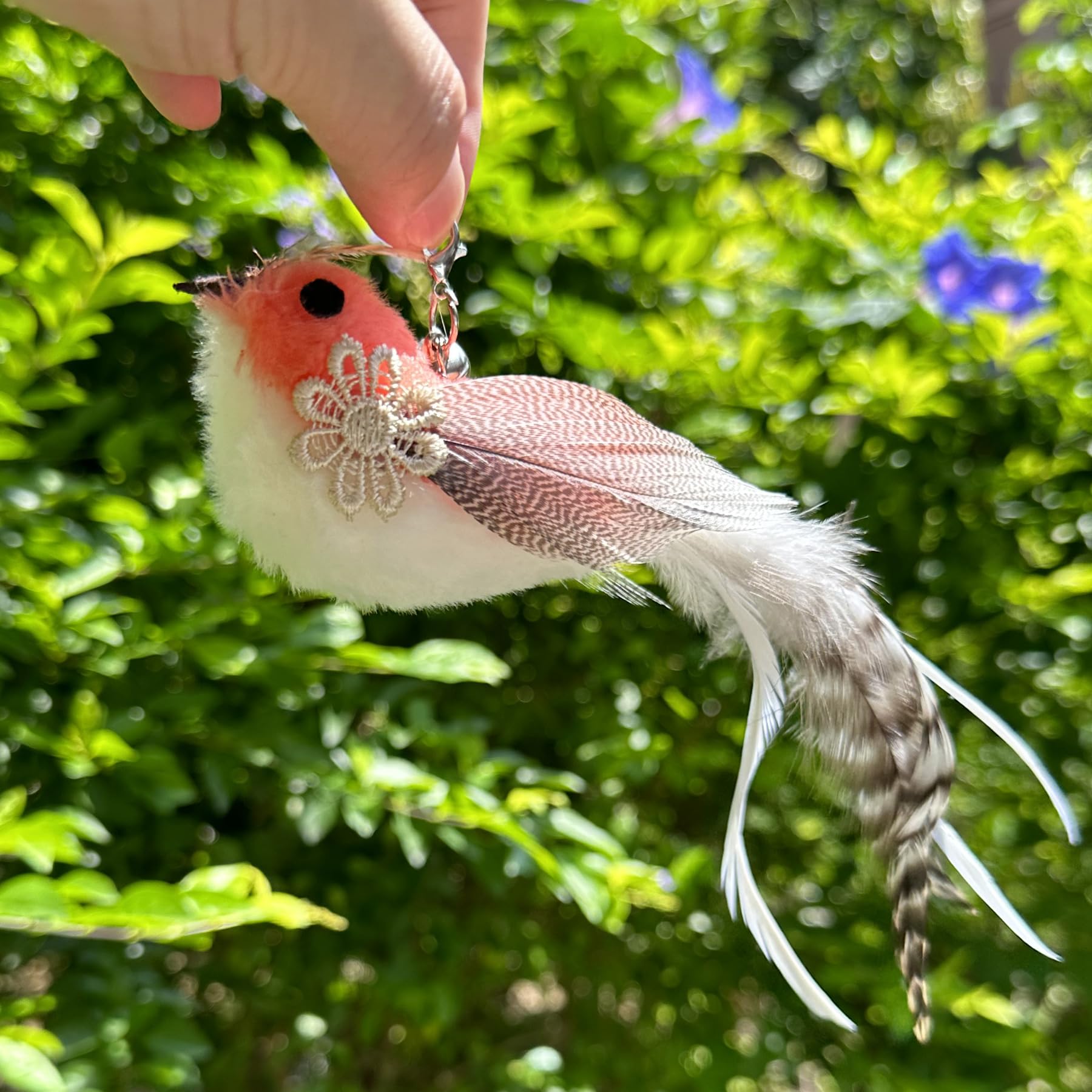 CATENEED wand toy setup with feather attachments in action