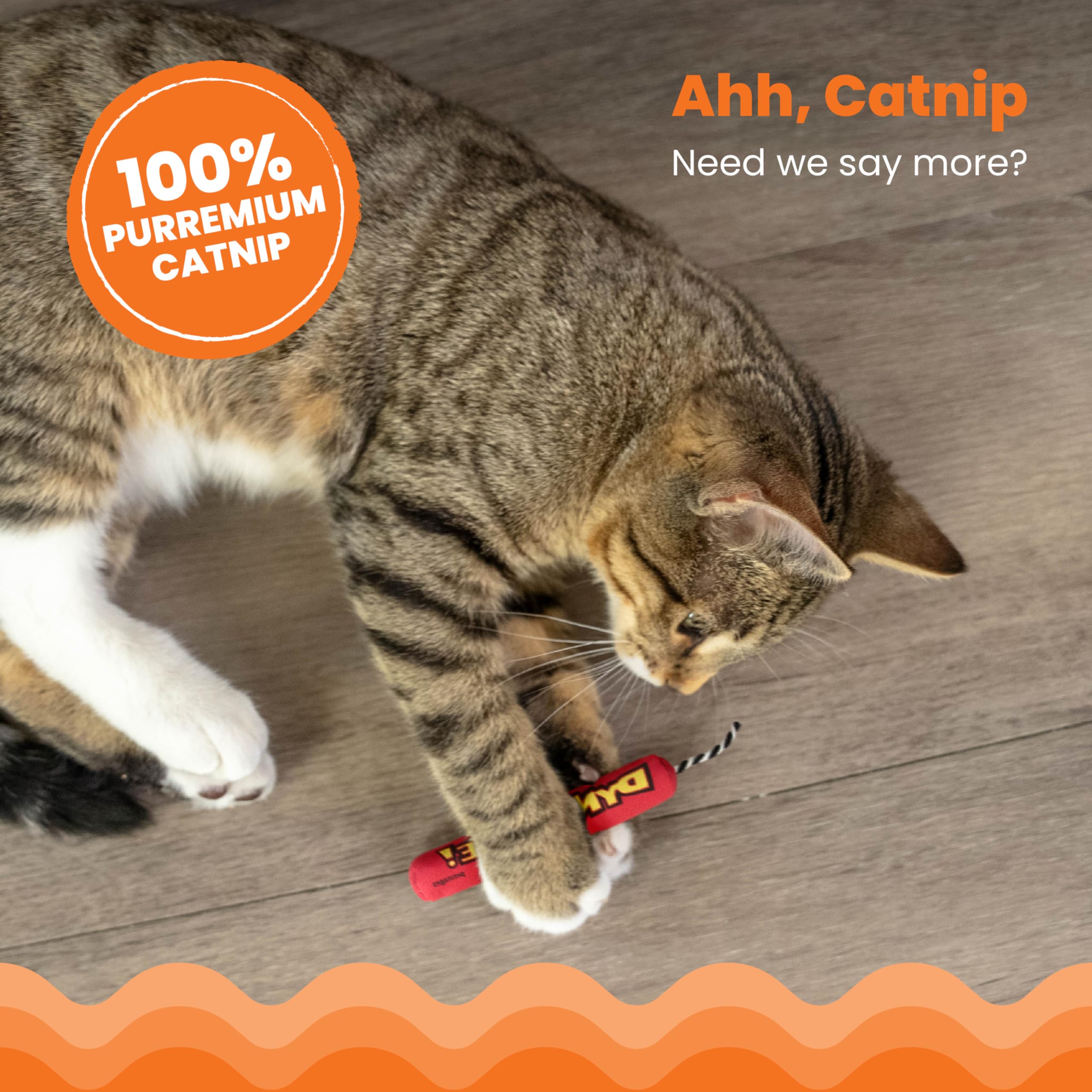 Catstages Green Magic Dynamite Stick catnip toy mid-kick scene encourages solo or shared play.