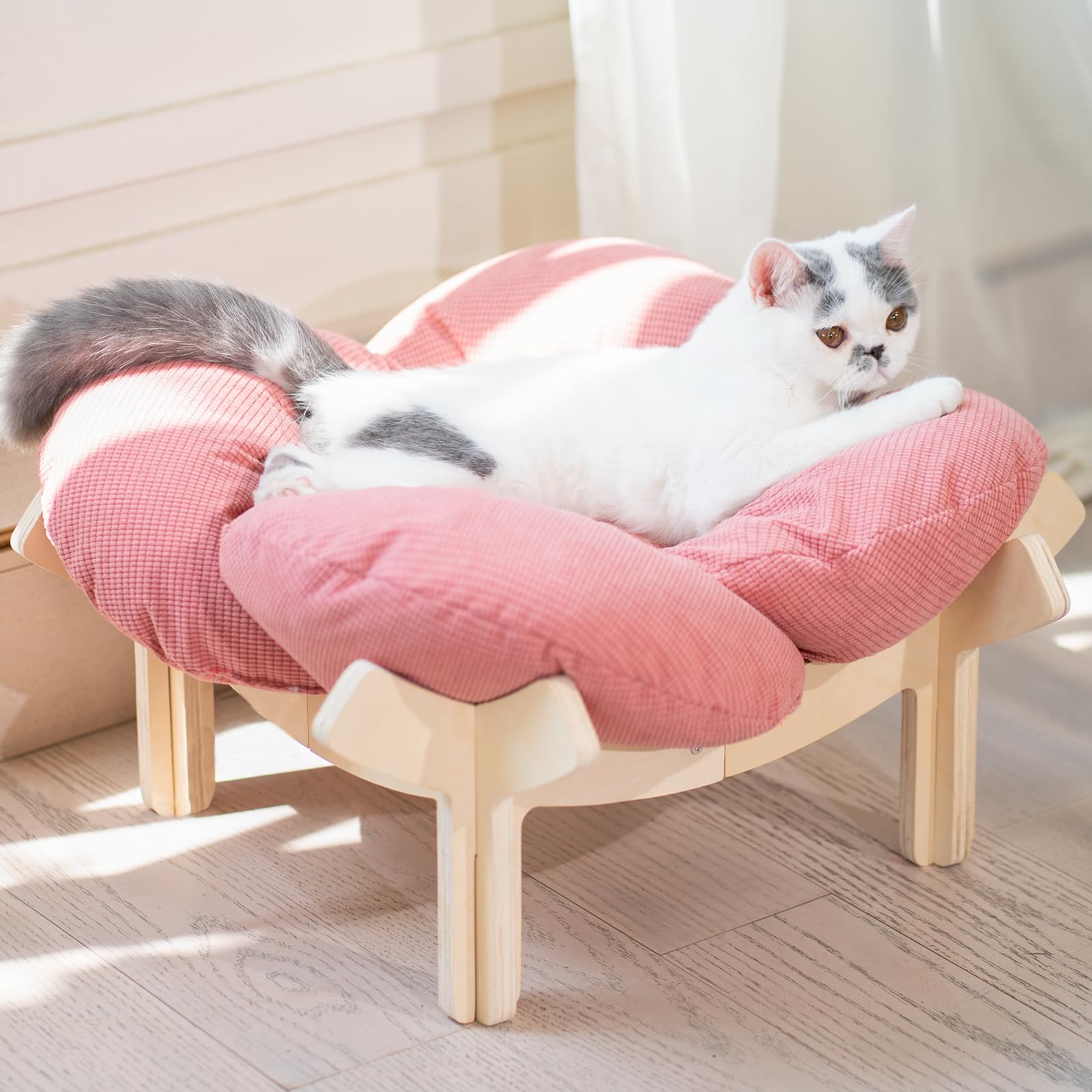 CHEERHOME PETS elevated cat bed with wooden base pink demonstrates sturdy support for restful lounging.