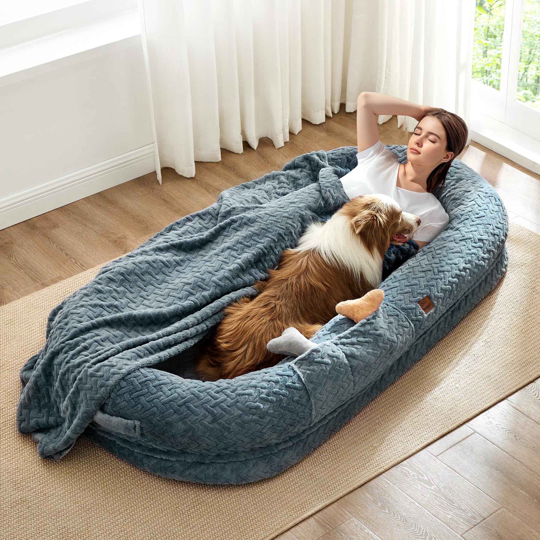 ChiXnuggle human dog bed in grayish blue shows a spacious resting surface