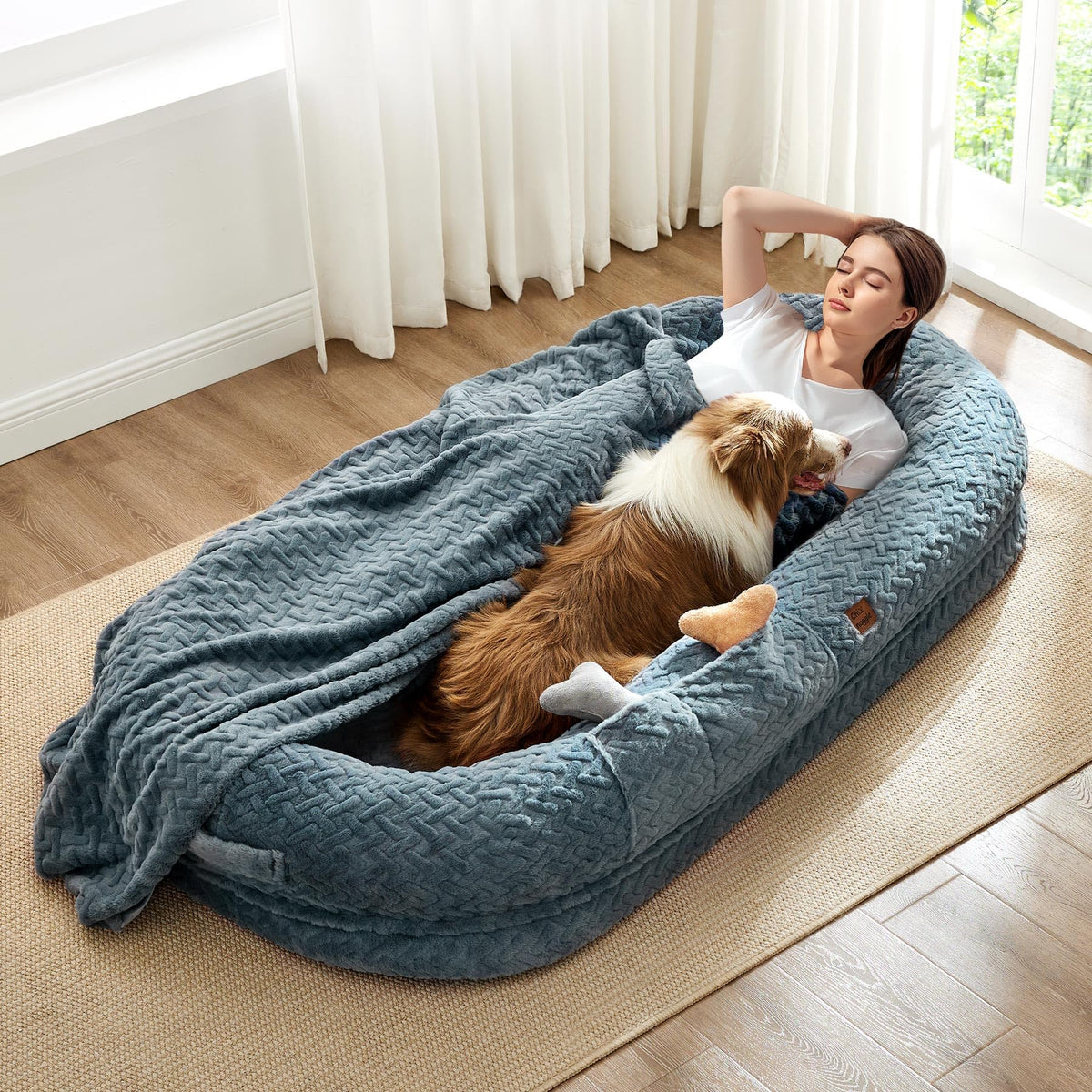 ChiXnuggle human dog bed in grayish blue shows a spacious resting surface