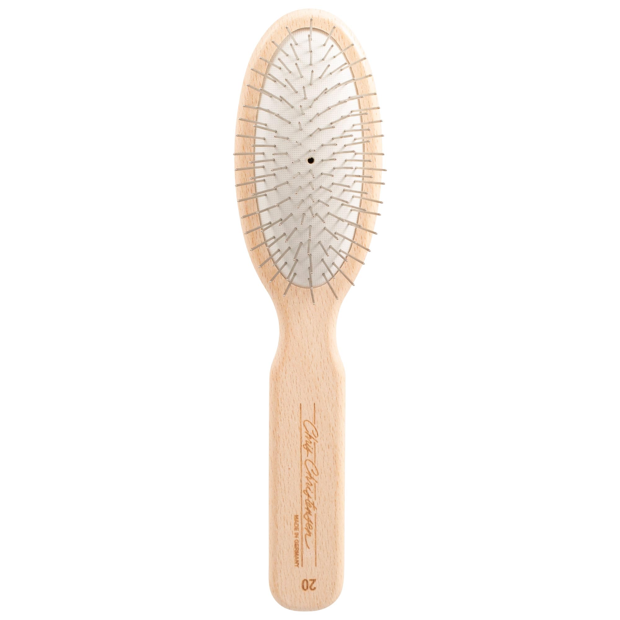Chris Christensen 20mm oval-pin dog brush gliding through delicate coat for gentle grooming