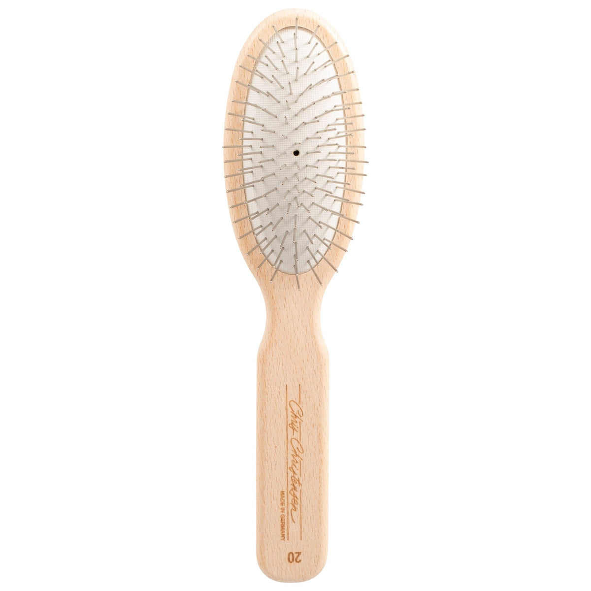 Chris Christensen 20mm oval-pin dog brush gliding through delicate coat for gentle grooming