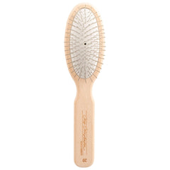Chris Christensen 20mm oval-pin dog brush gliding through delicate coat for gentle grooming