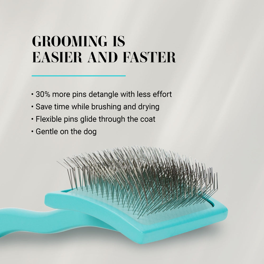 Chris Christensen Big G Dog Slicker teal brush ergonomic handle for comfortable grooming sessions.