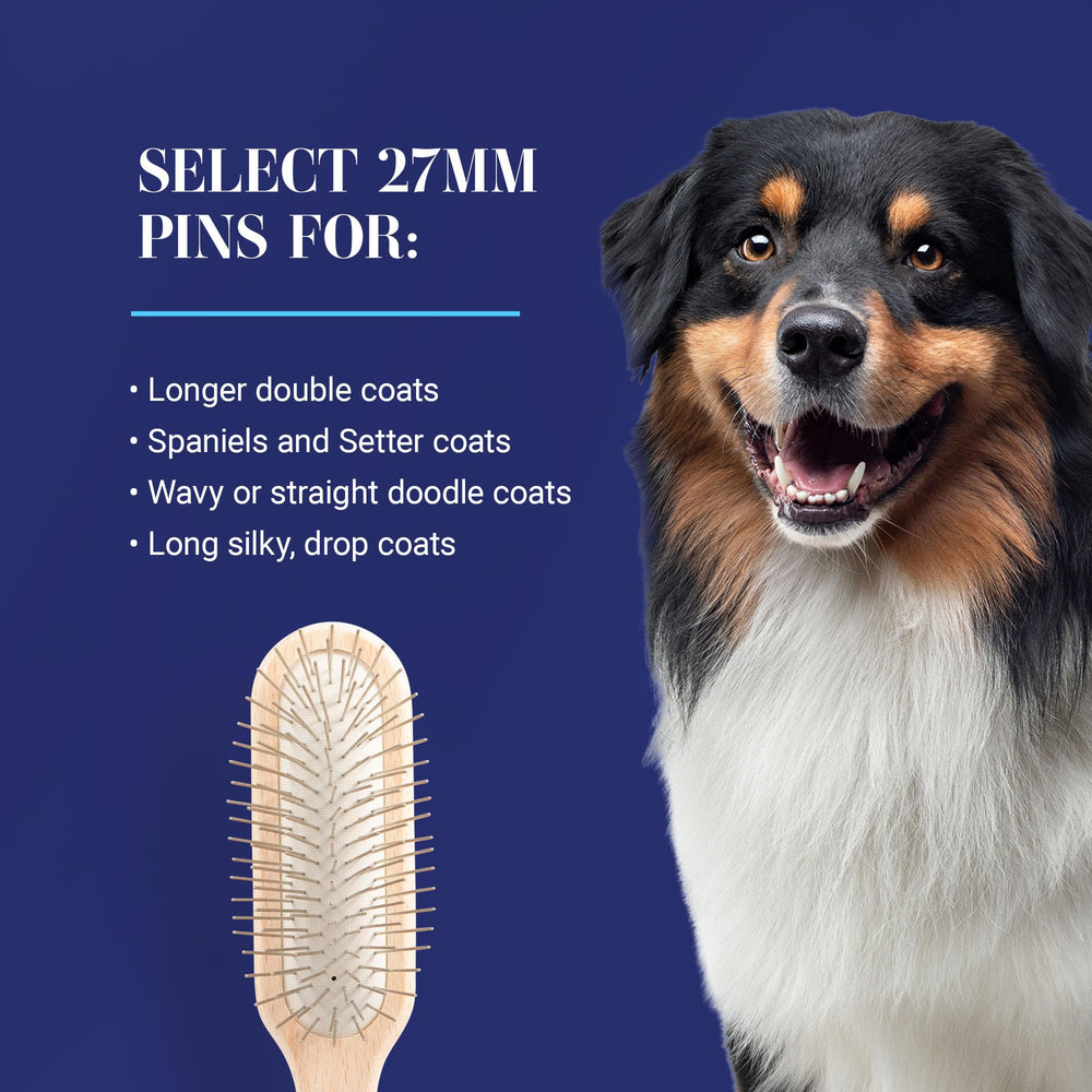 Chris Christensen lightweight brush in hand with ergonomic grip for comfortable grooming.