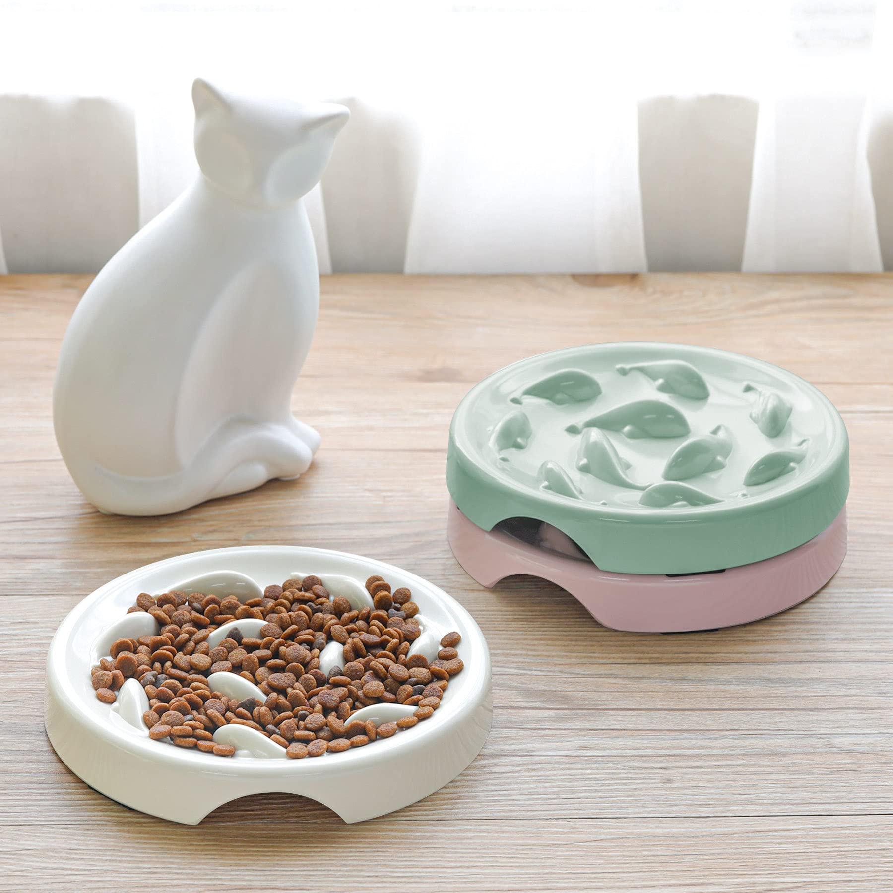 Cilkus green bowl on floor demonstrates versatile home use for cats and small dogs.
