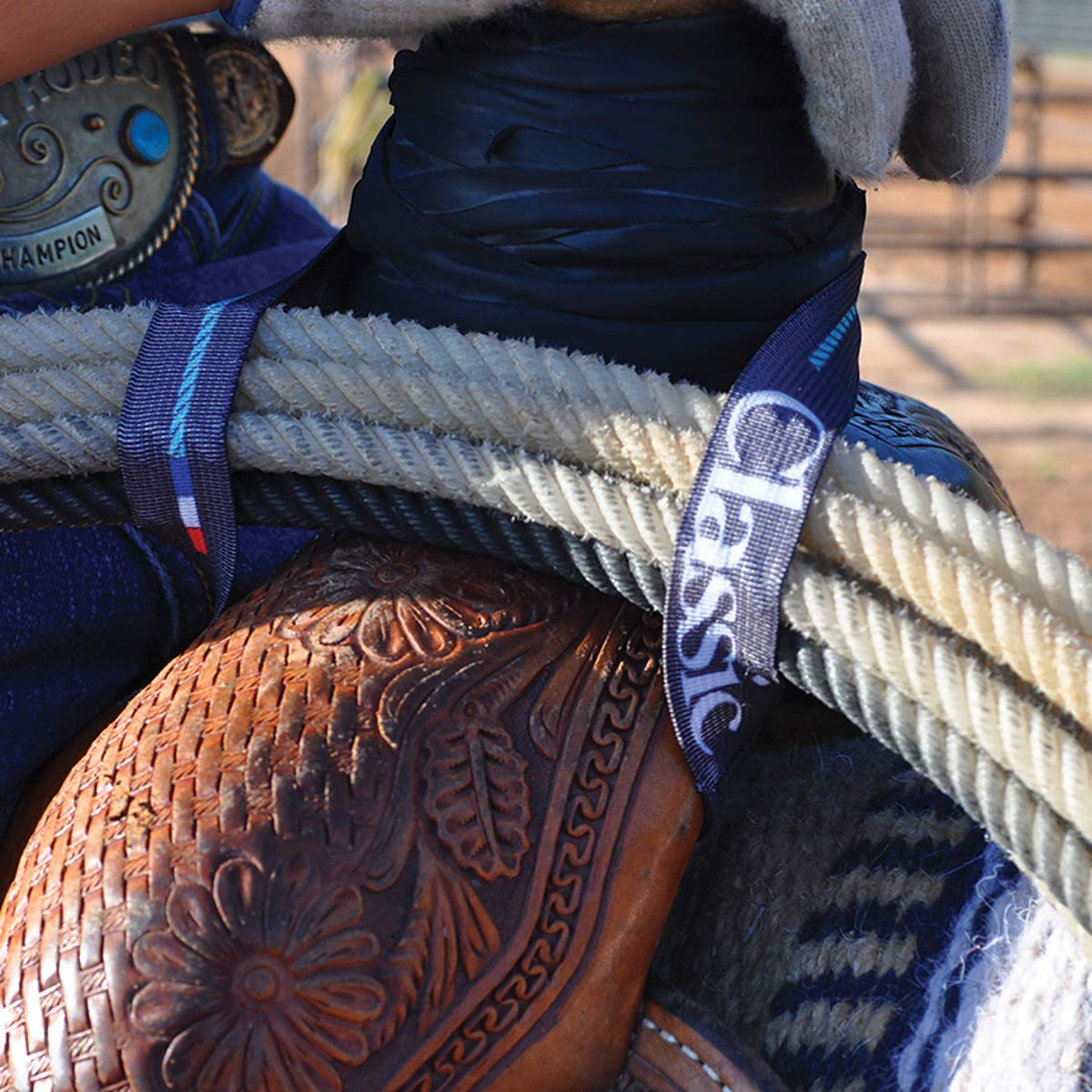 Classic Equine Elastic Rope Strap buckle detail highlights durable hardware for secure roping during rides.